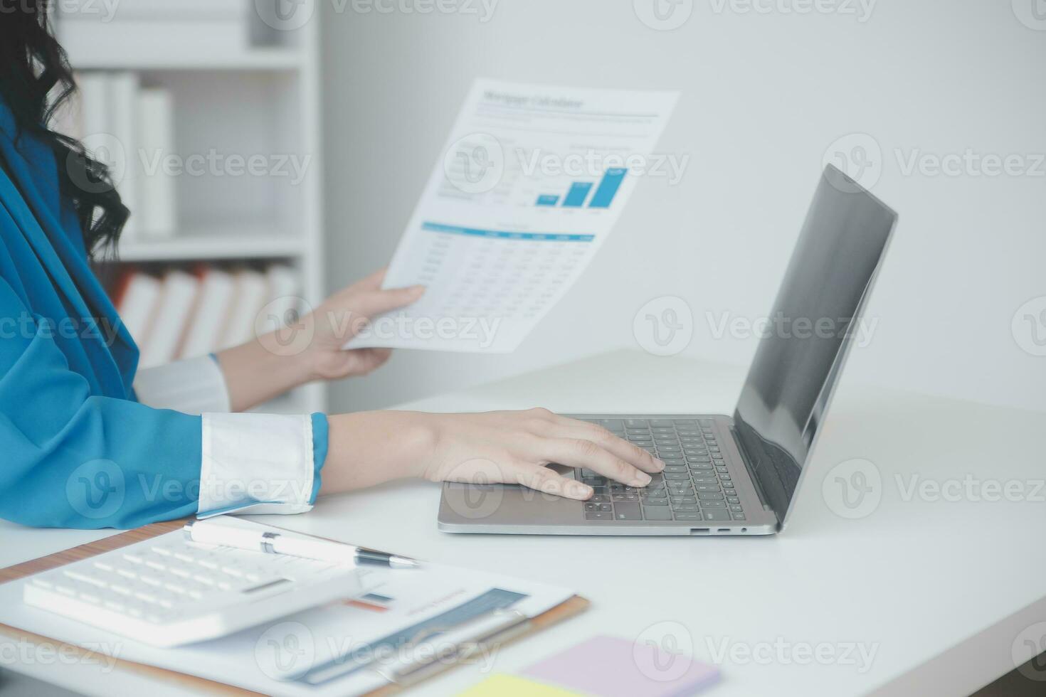 Audit concept,Administrator business man financial inspector and secretary making report calculating balance. Internal Revenue Service checking document. photo