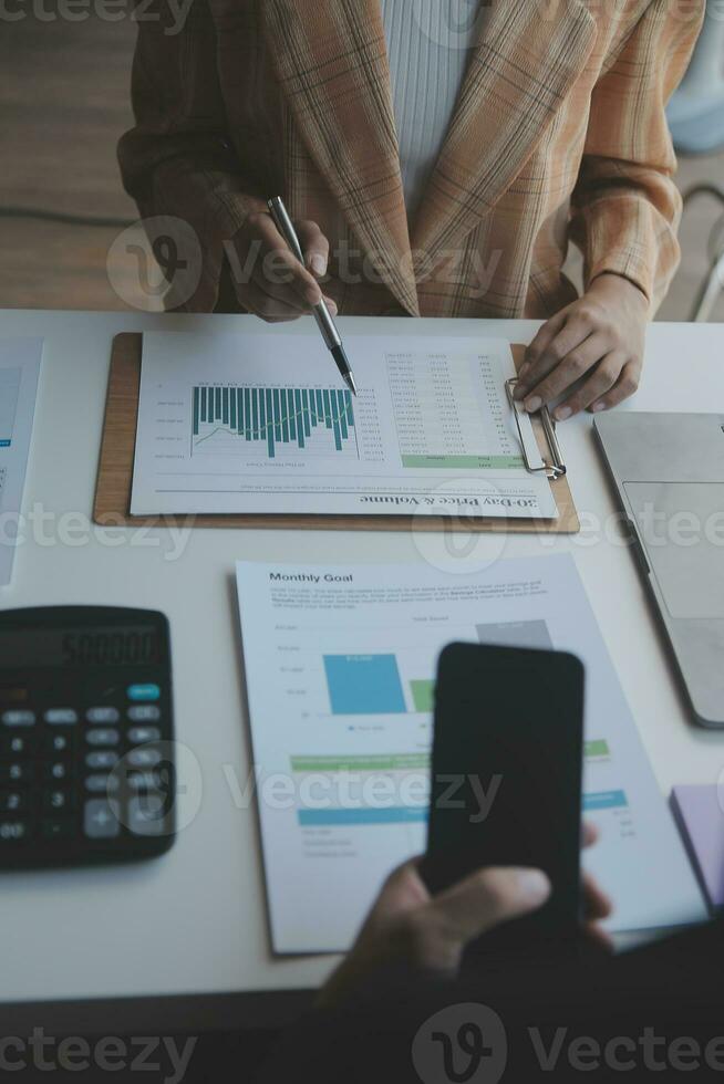 Audit concept,Administrator business man financial inspector and secretary making report calculating balance. Internal Revenue Service checking document. photo