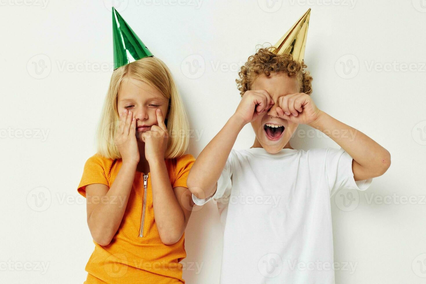 Cute preschool kids in multicolored caps birthday holiday emotion lifestyle unaltered photo