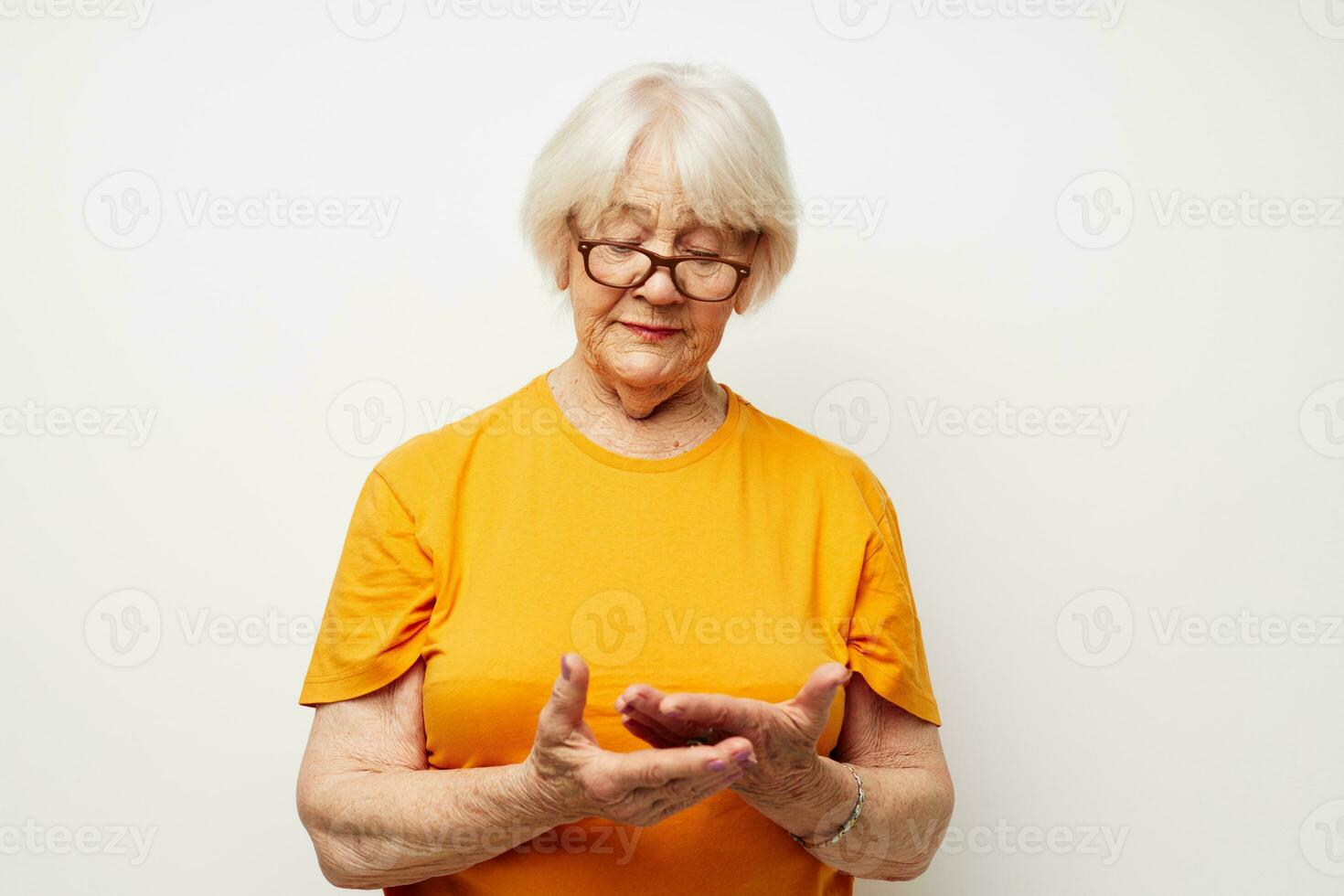 Photo of retired old lady vision problems with glasses light background