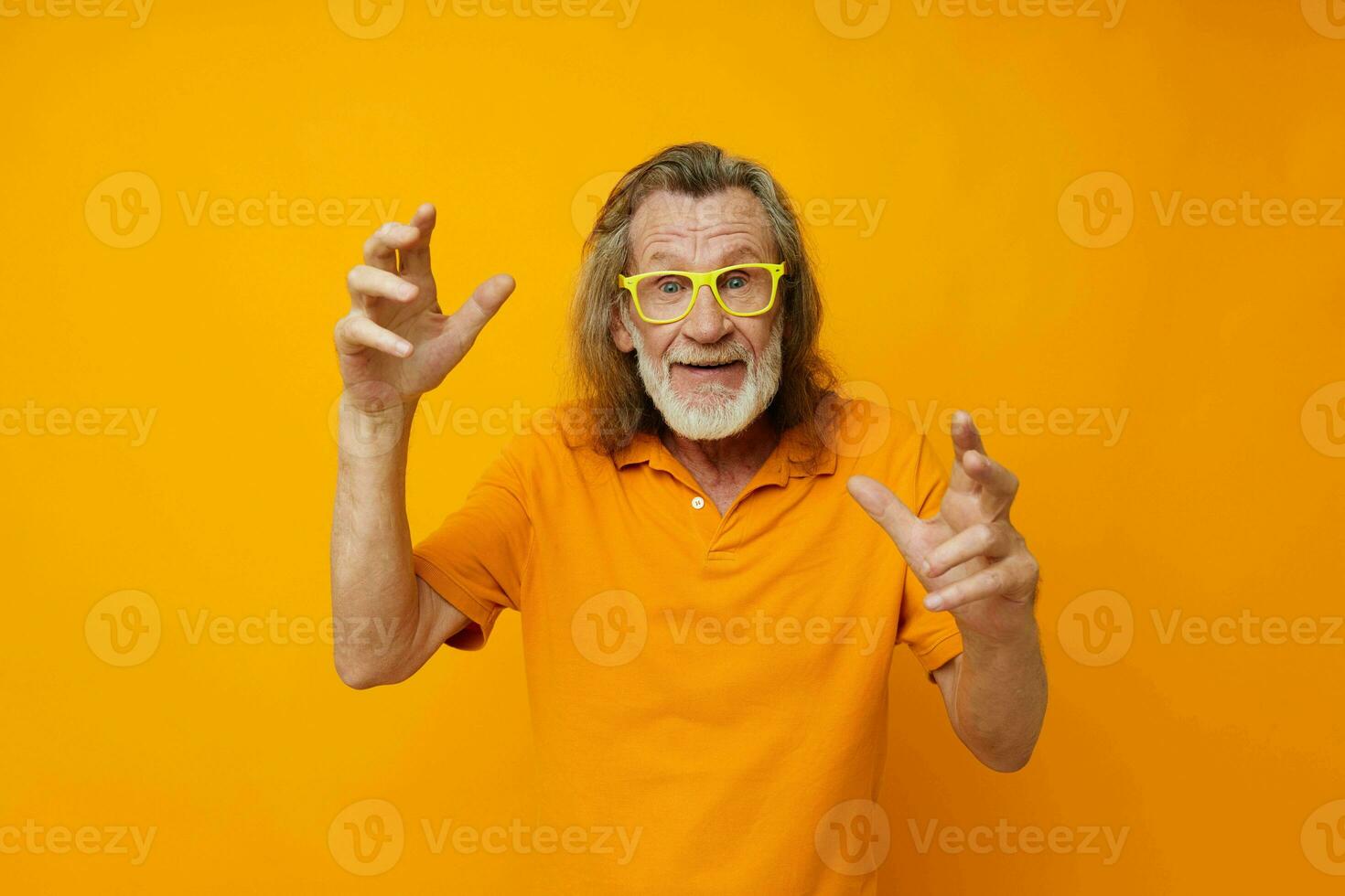 Portrait of happy senior man hand gestures emotions yellow glasses isolated background photo