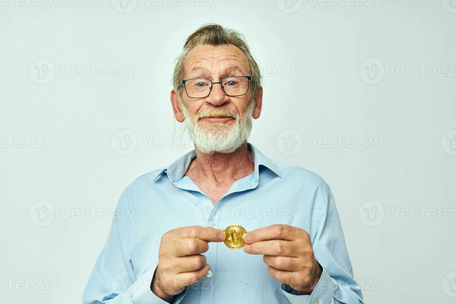 Portrait of happy senior man cryptocurrency bitcoin investment light background photo