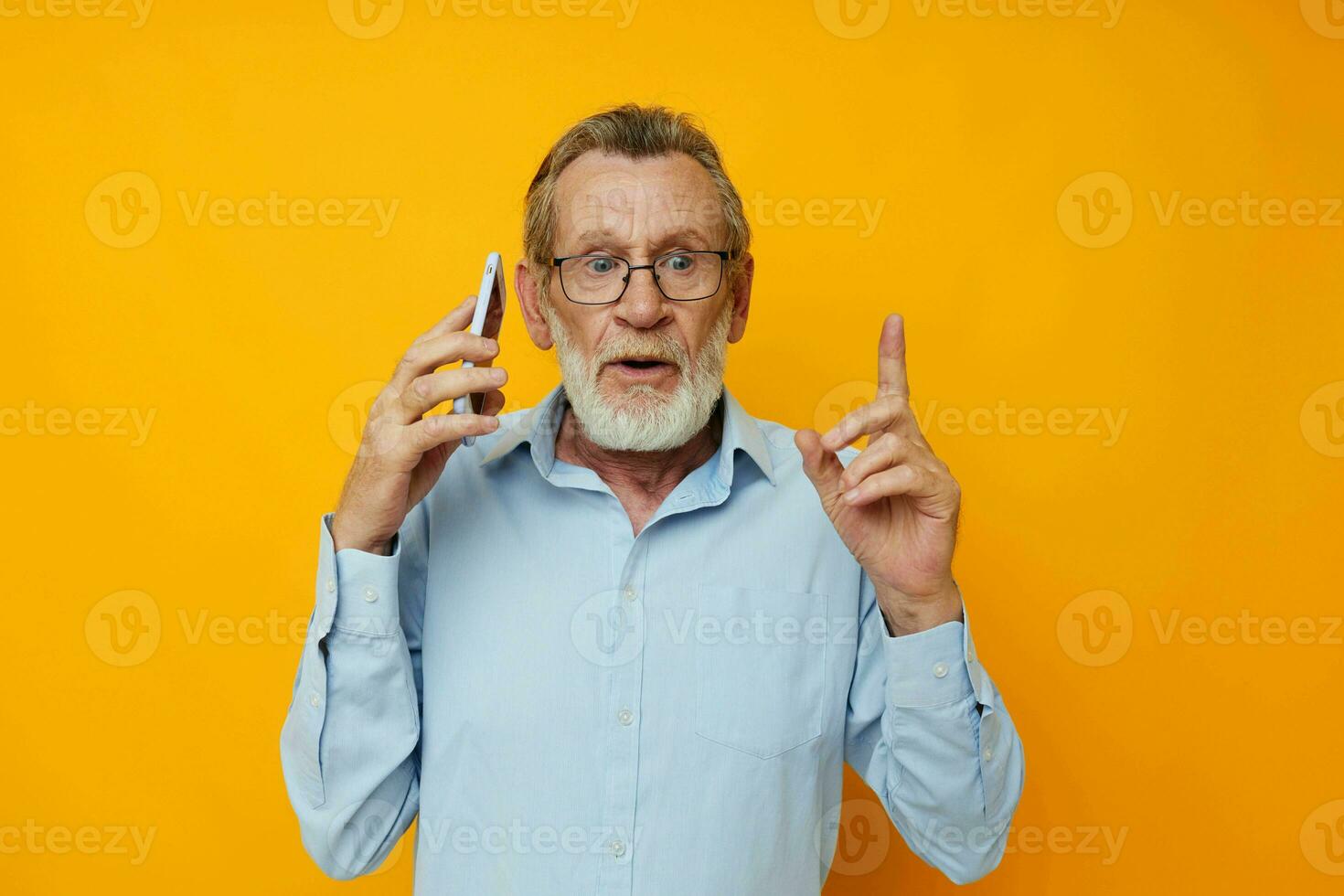 Portrait of happy senior man talking on the phone emotions isolated background photo