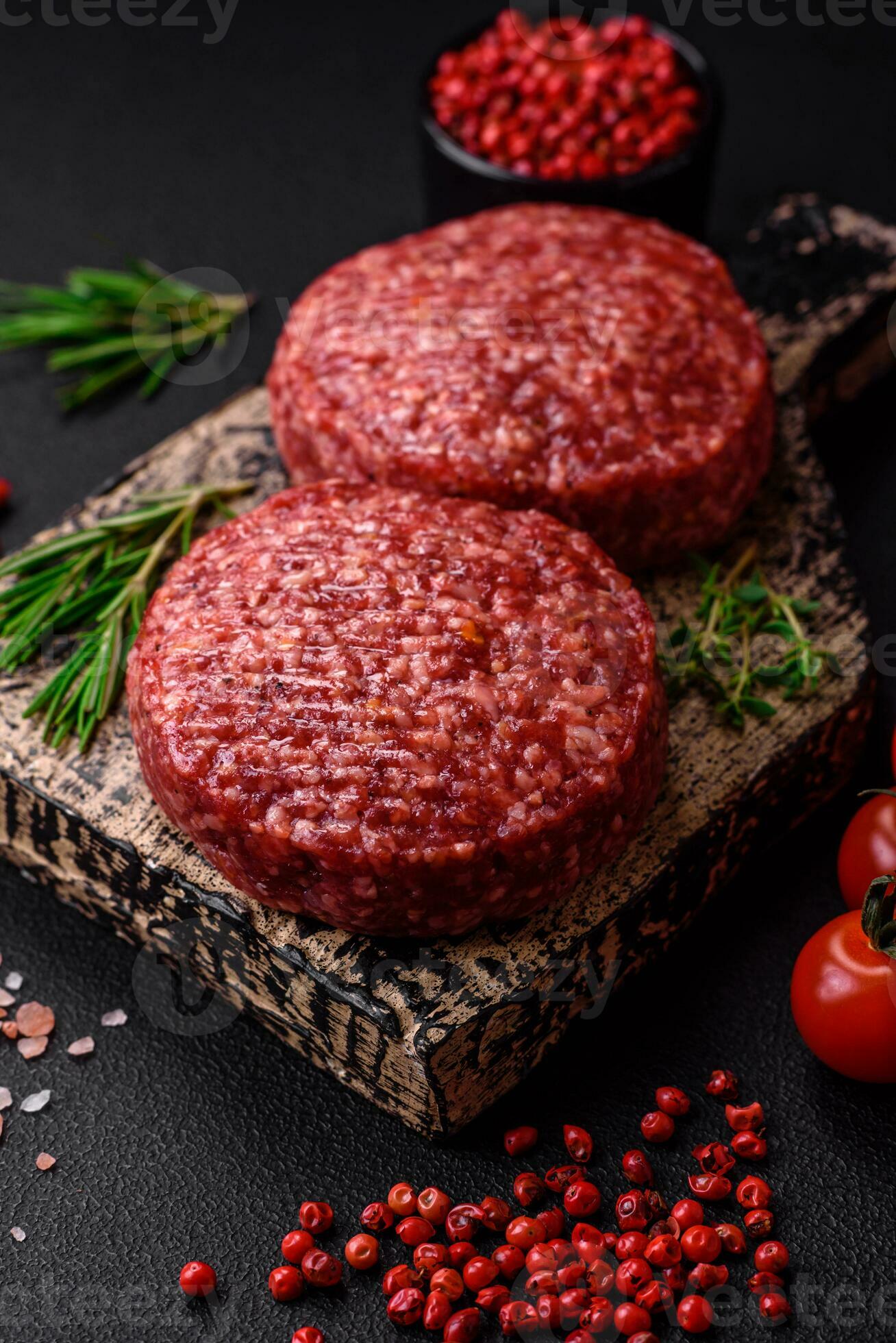 Fresh raw ground beef burger patty with salt and spices 25004474 Stock