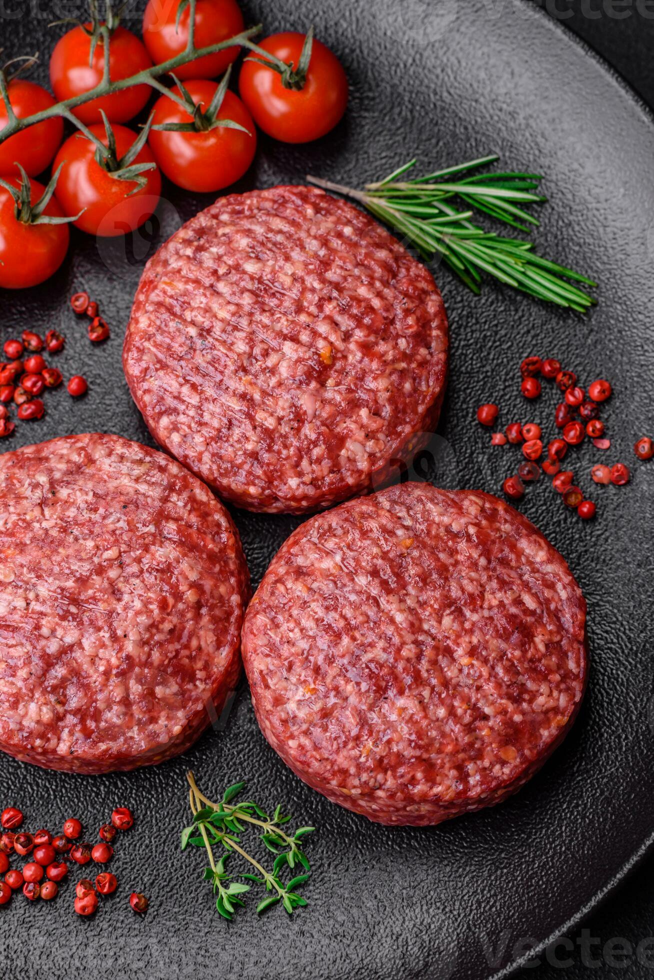 Fresh raw ground beef burger patty with salt and spices 25004480 Stock