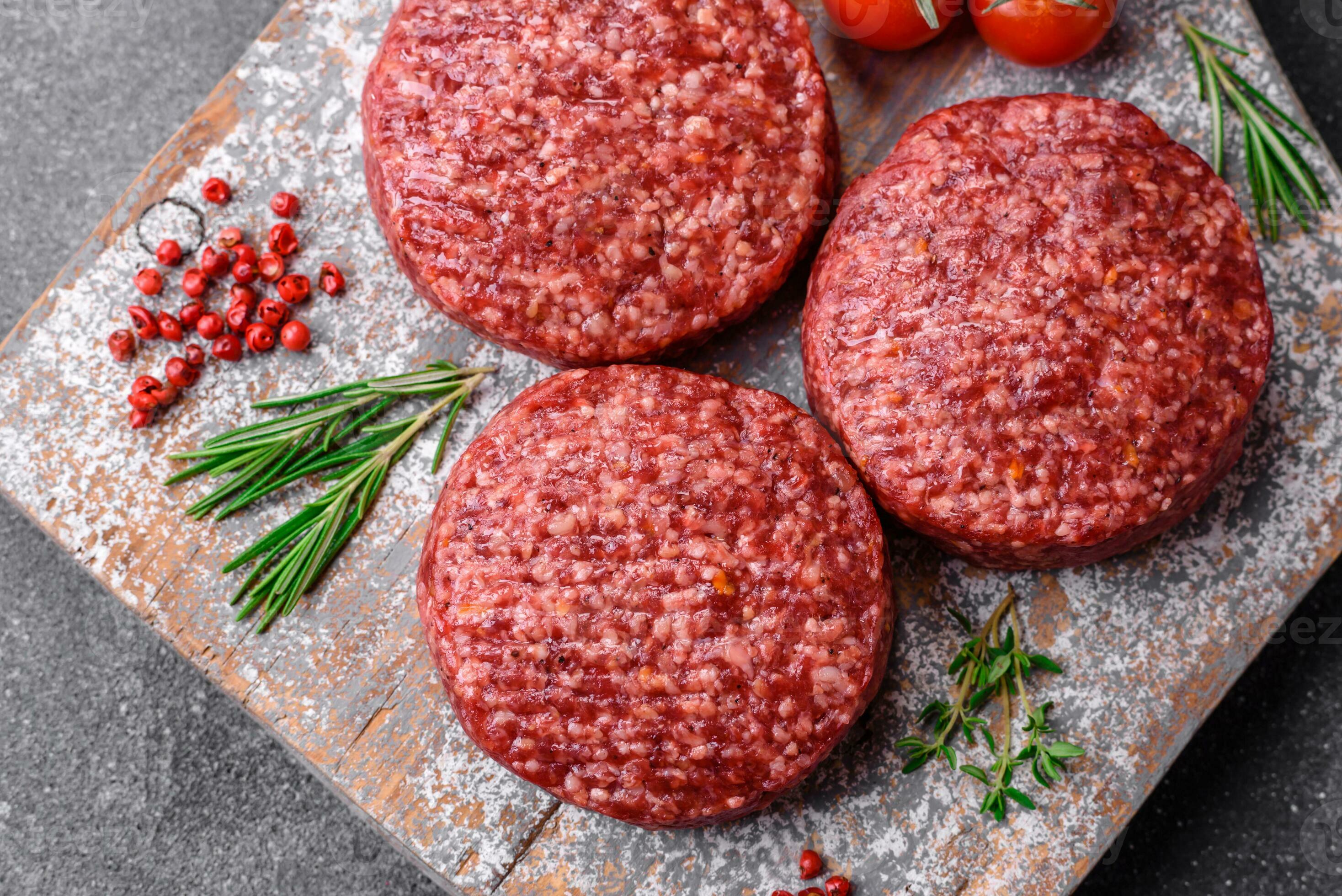 Fresh raw ground beef burger patty with salt and spices 25004481 Stock
