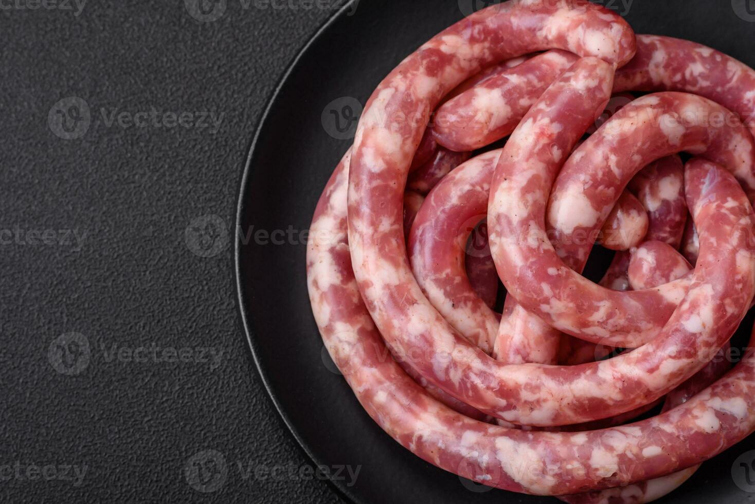 Raw sausages from pork or beef with salt, spices and herbs photo