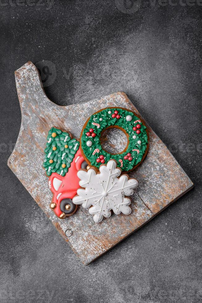 Delicious beautiful Christmas gingerbread cookies on a textured concrete background photo