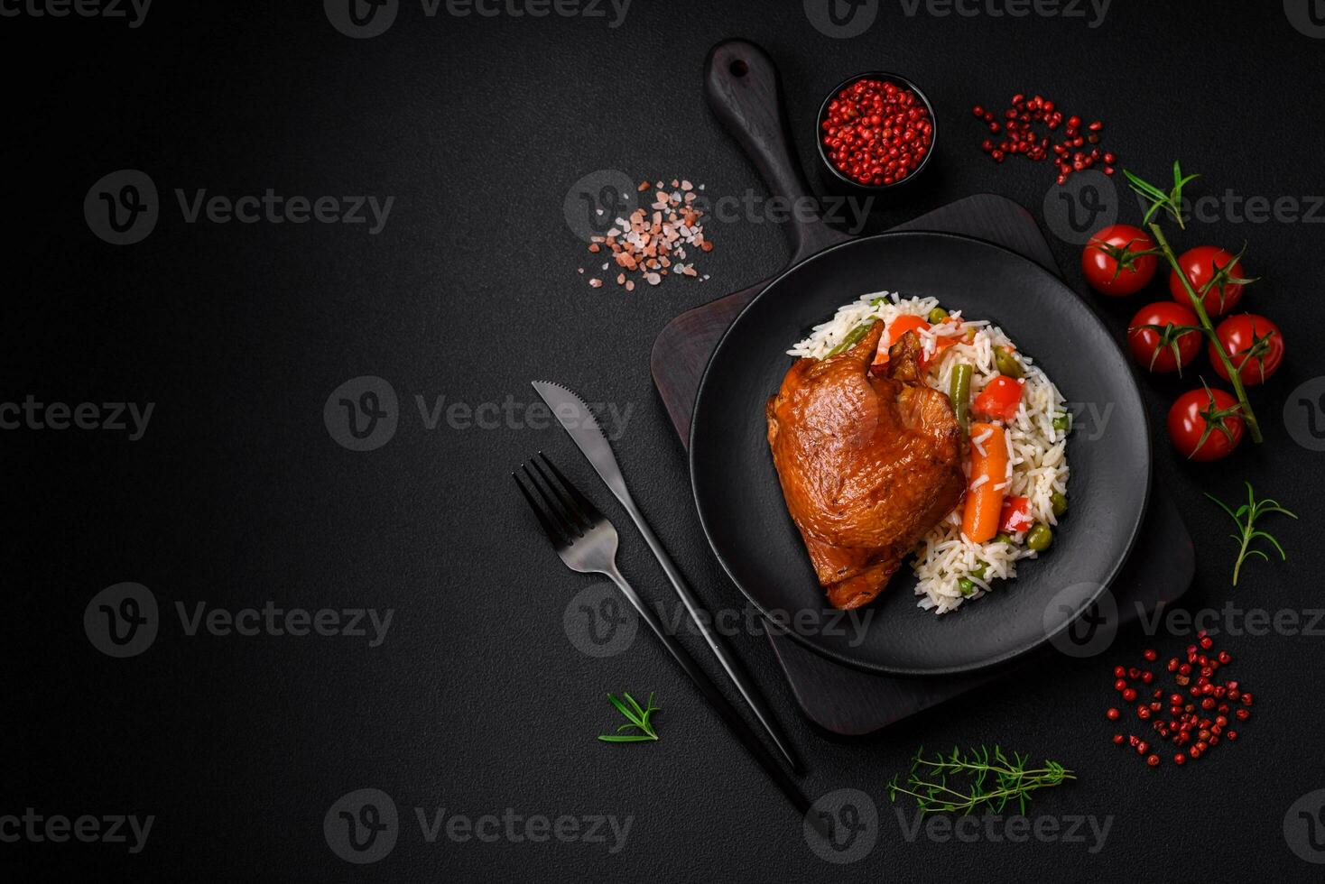 Delicious boiled rice with chicken and vegetables or risotto with salt, spices and herbs photo