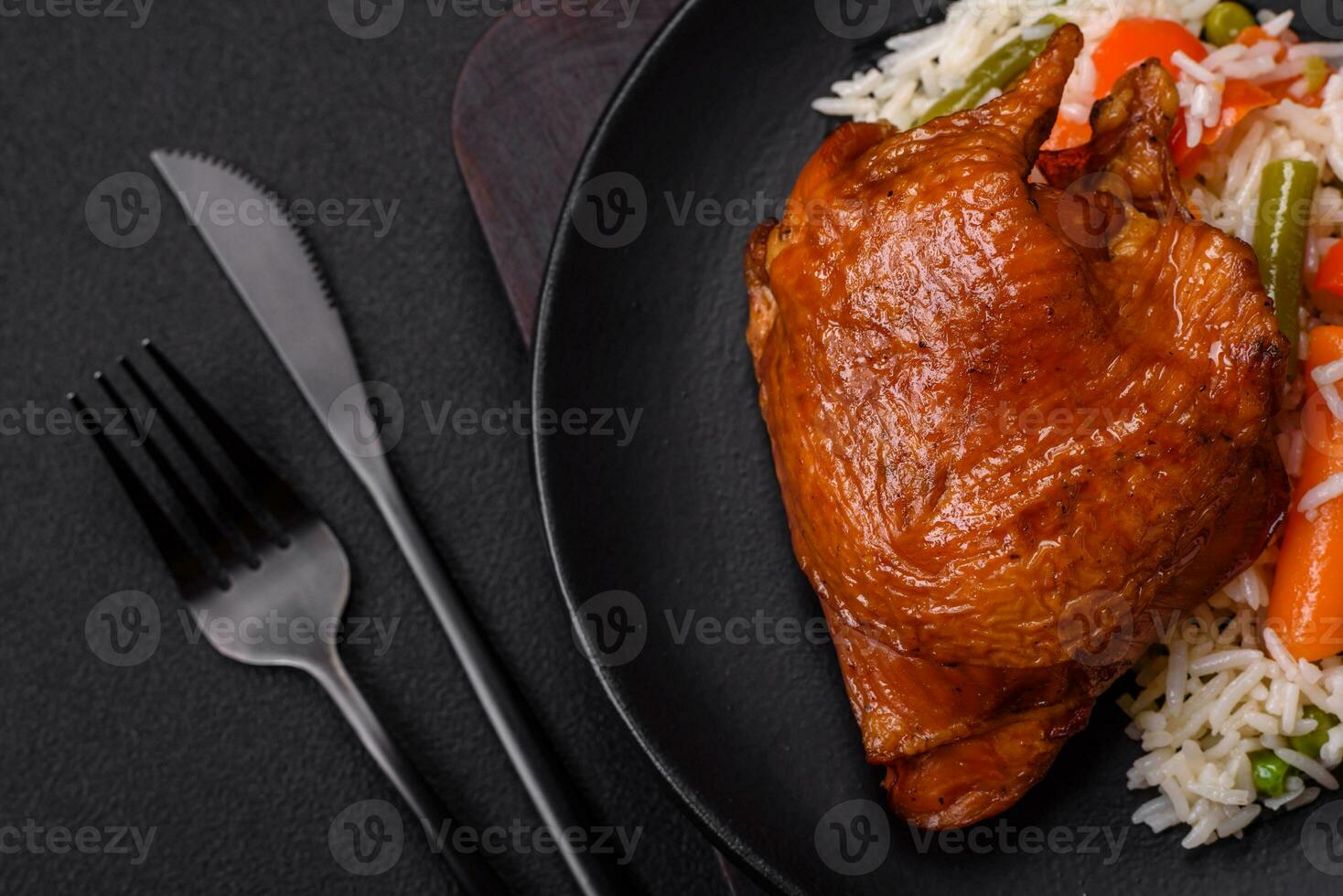 Delicious boiled rice with chicken and vegetables or risotto with salt, spices and herbs photo