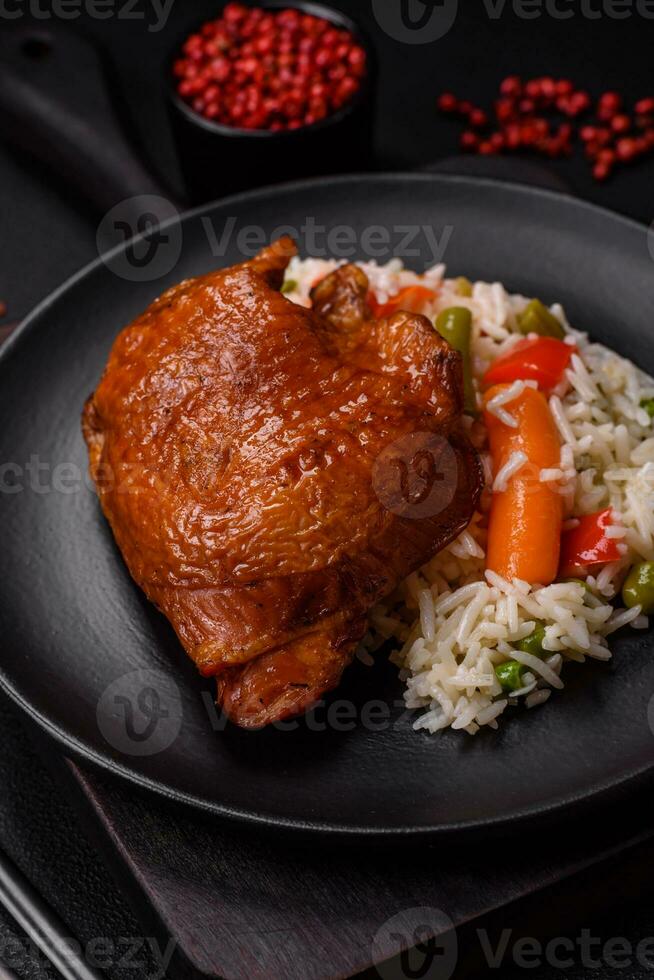 Delicious boiled rice with chicken and vegetables or risotto with salt, spices and herbs photo