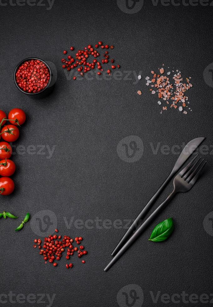 Ingredients for cooking cherry tomatoes, salt, spices and herbs photo