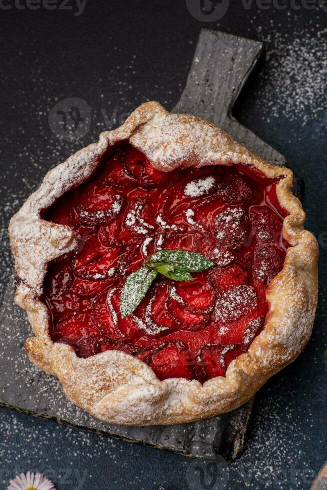 Delicious fresh sweet homemade rustic style strawberry tart photo