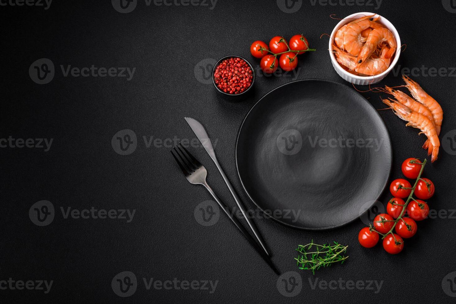 Ingredients for cooking cherry tomatoes, shrimp, salt and spices photo