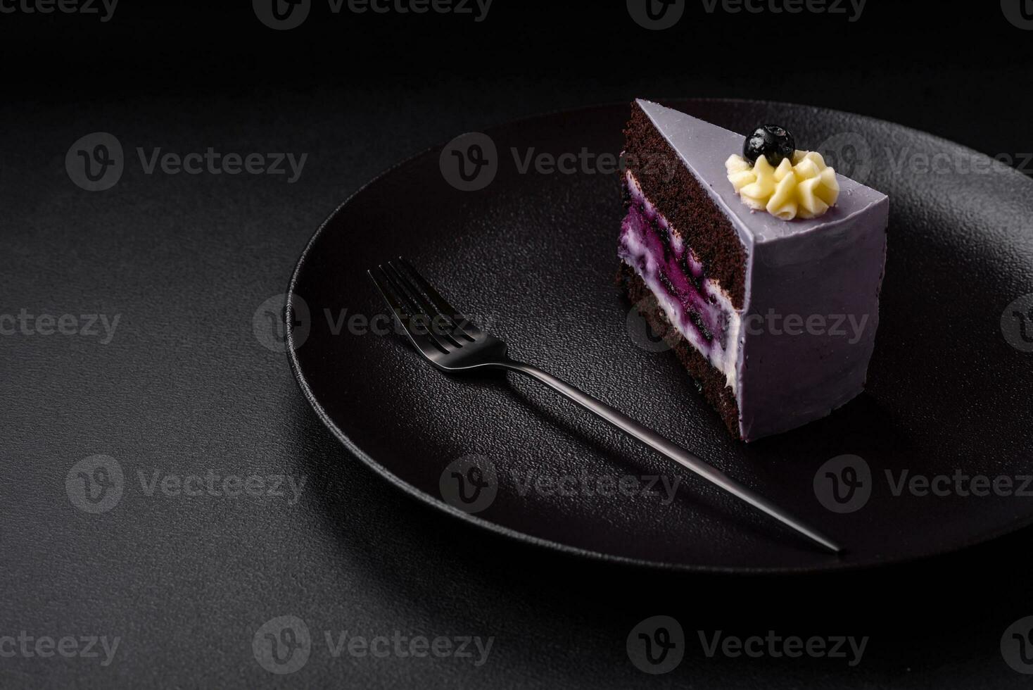Delicious fresh blueberry or blackcurrant cake with cream cheese photo