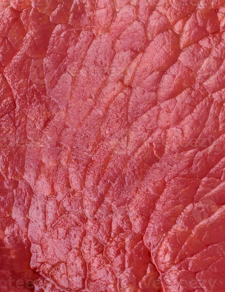 Raw beef eye steak round with salt, spices and herbs photo