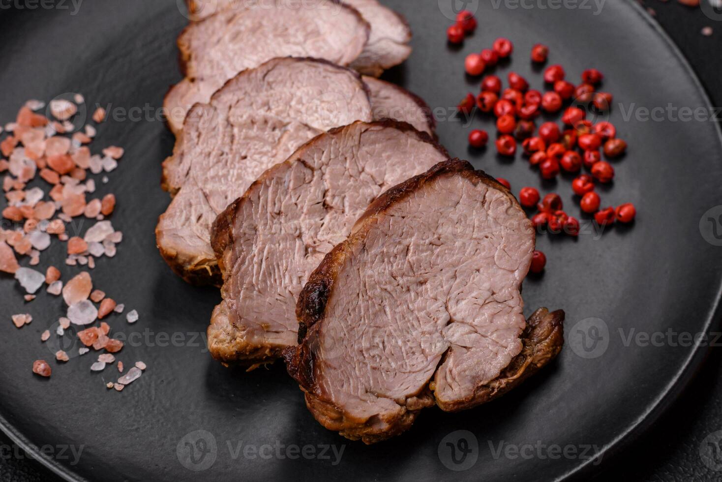 Delicious beef steak with salt, spices and herbs on a ceramic plate photo