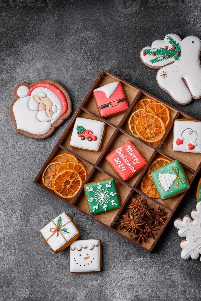 Beautiful colored Christmas gingerbread cookies for the design and decoration photo