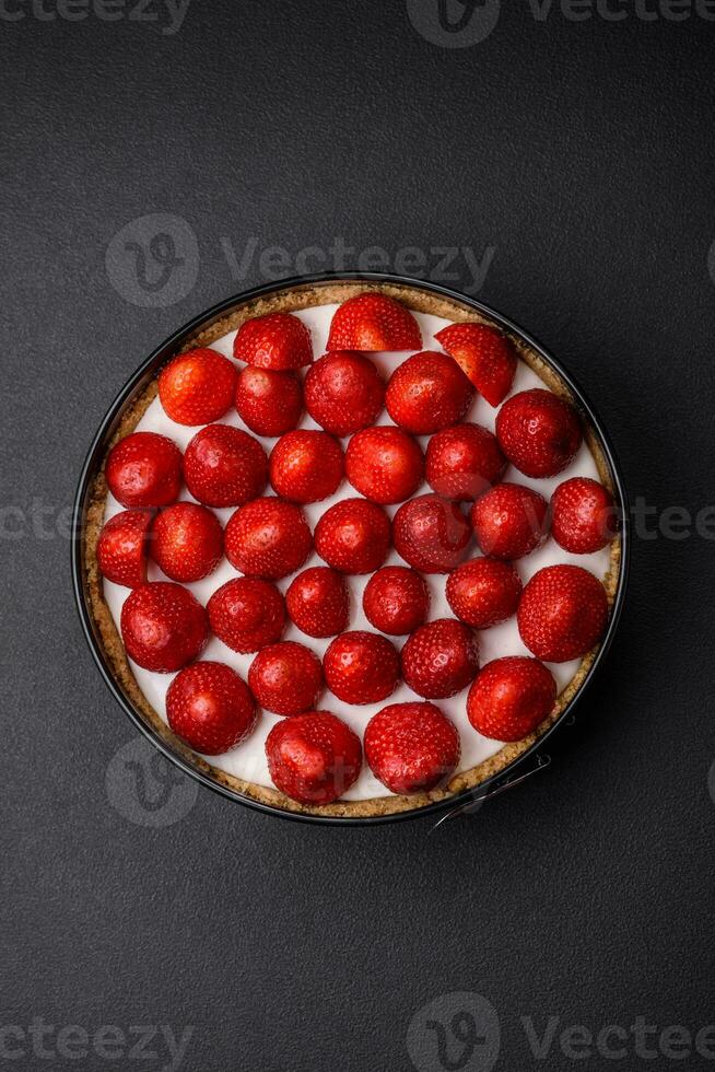 Delicious sweet cake or cheesecake with mascarpone cheese and strawberries photo