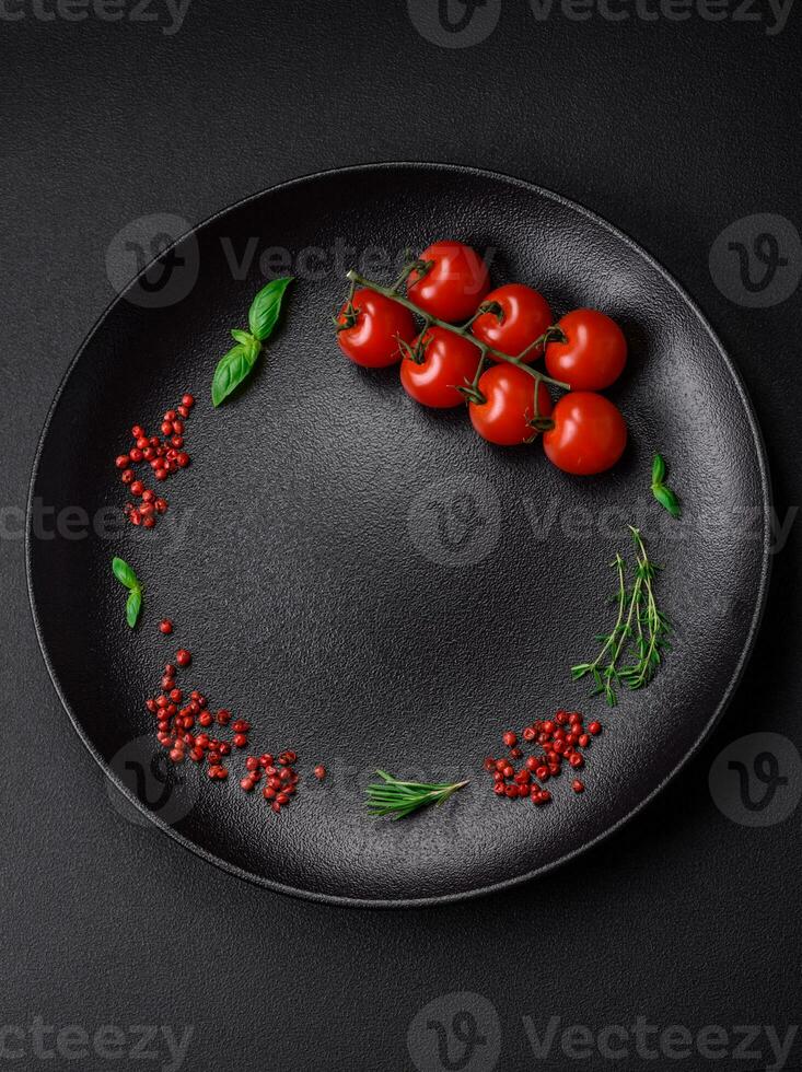 Ingredients for cooking cherry tomatoes, salt, spices and herbs photo