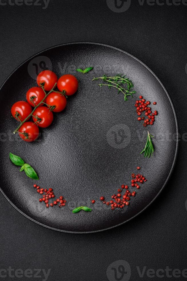 Ingredients for cooking cherry tomatoes, salt, spices and herbs photo