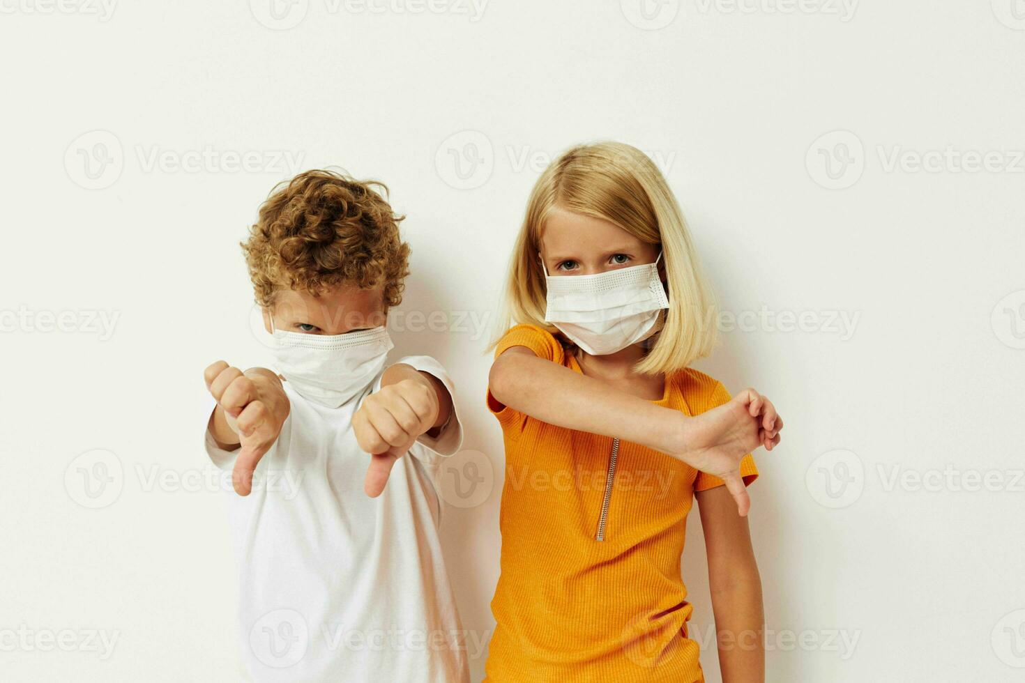 cheerful children in medical mask protection posing grimace lifestyle unaltered photo