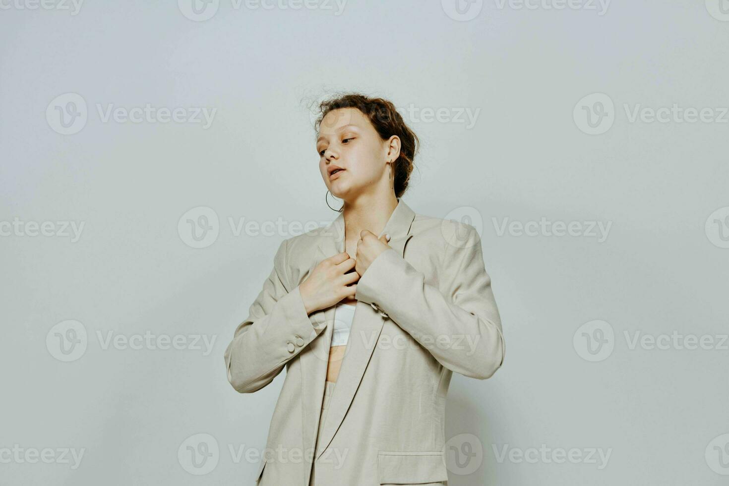 pretty woman Clothes fitting elegant style suit fashion studio light background unaltered photo
