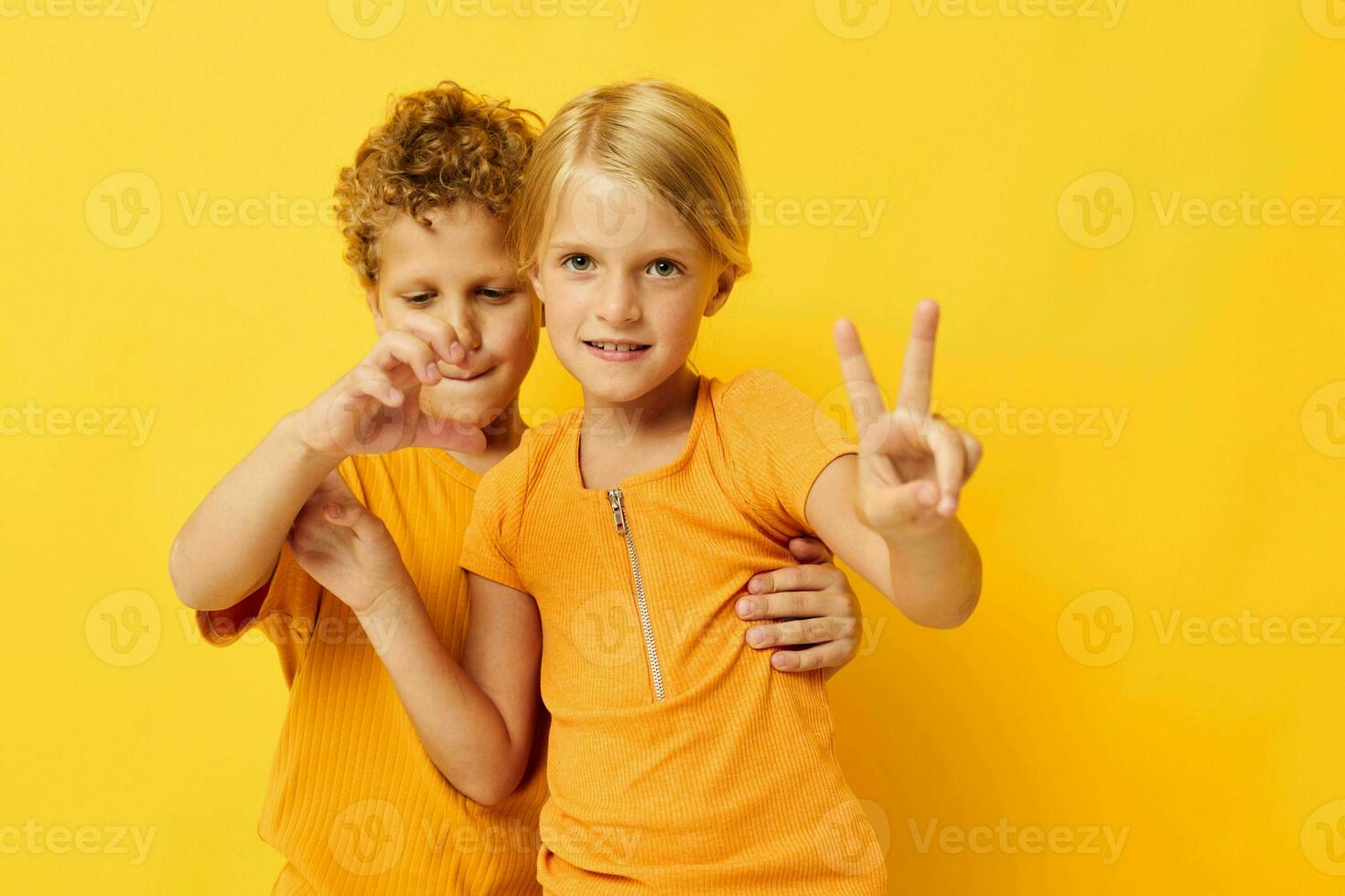 Boy and girl cuddling fashion childhood entertainment isolated background unaltered photo