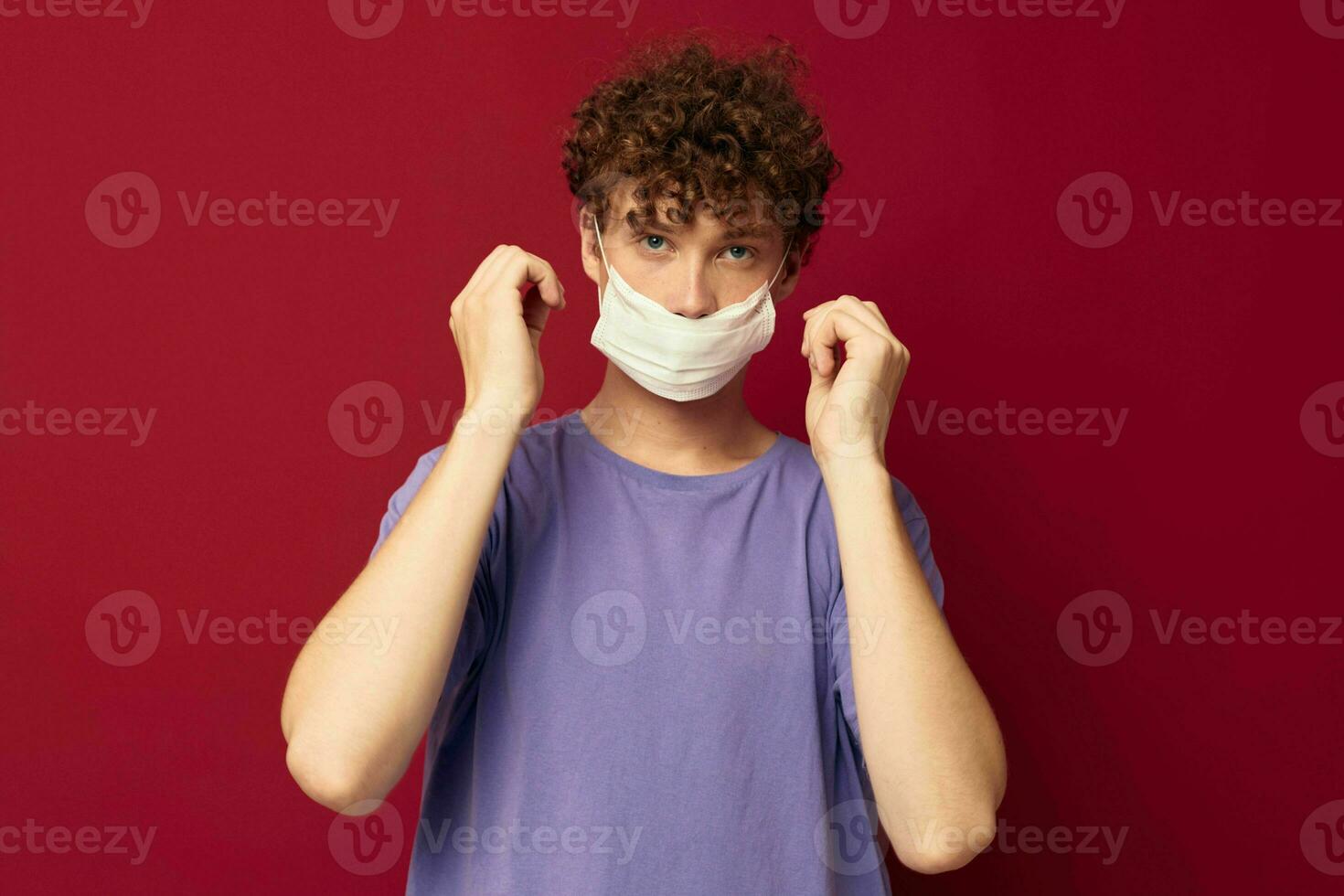 A young man red hair protective mask disease protection isolated background unaltered photo