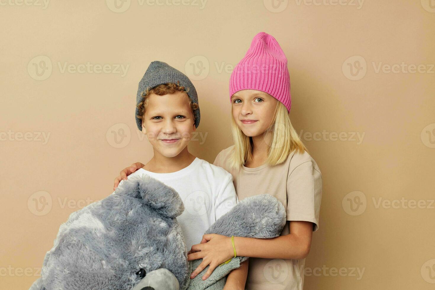 Little boy and girl standing next to posing toy emotions Lifestyle unaltered photo