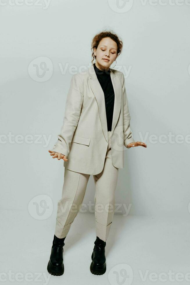 cheerful woman In a light classic suit posing emotions isolated backgrounds unaltered photo