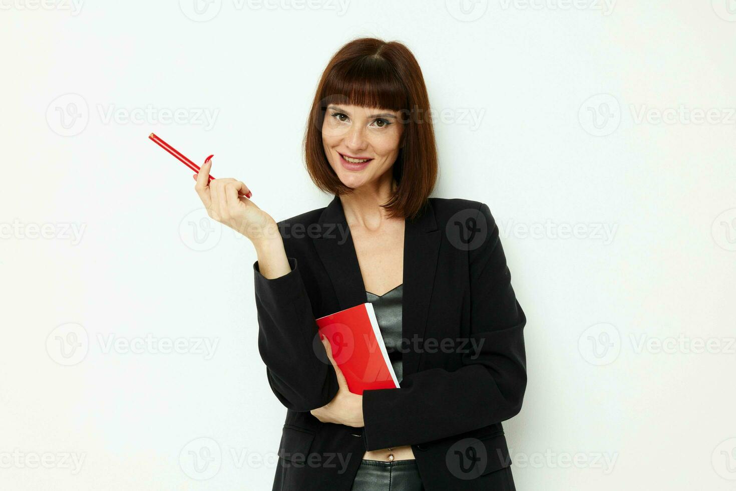 beautiful woman in a black jacket notepad writing ideas isolated background photo