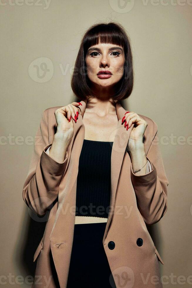 portrait of a woman short haired suit gesturing with hands isolated background photo