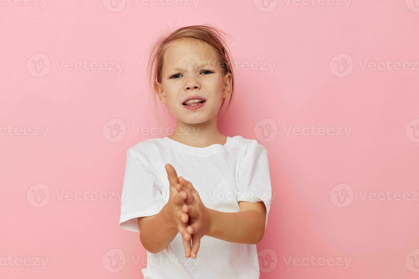 Portrait of happy smiling child girl emotion hands gesture childhood unaltered photo