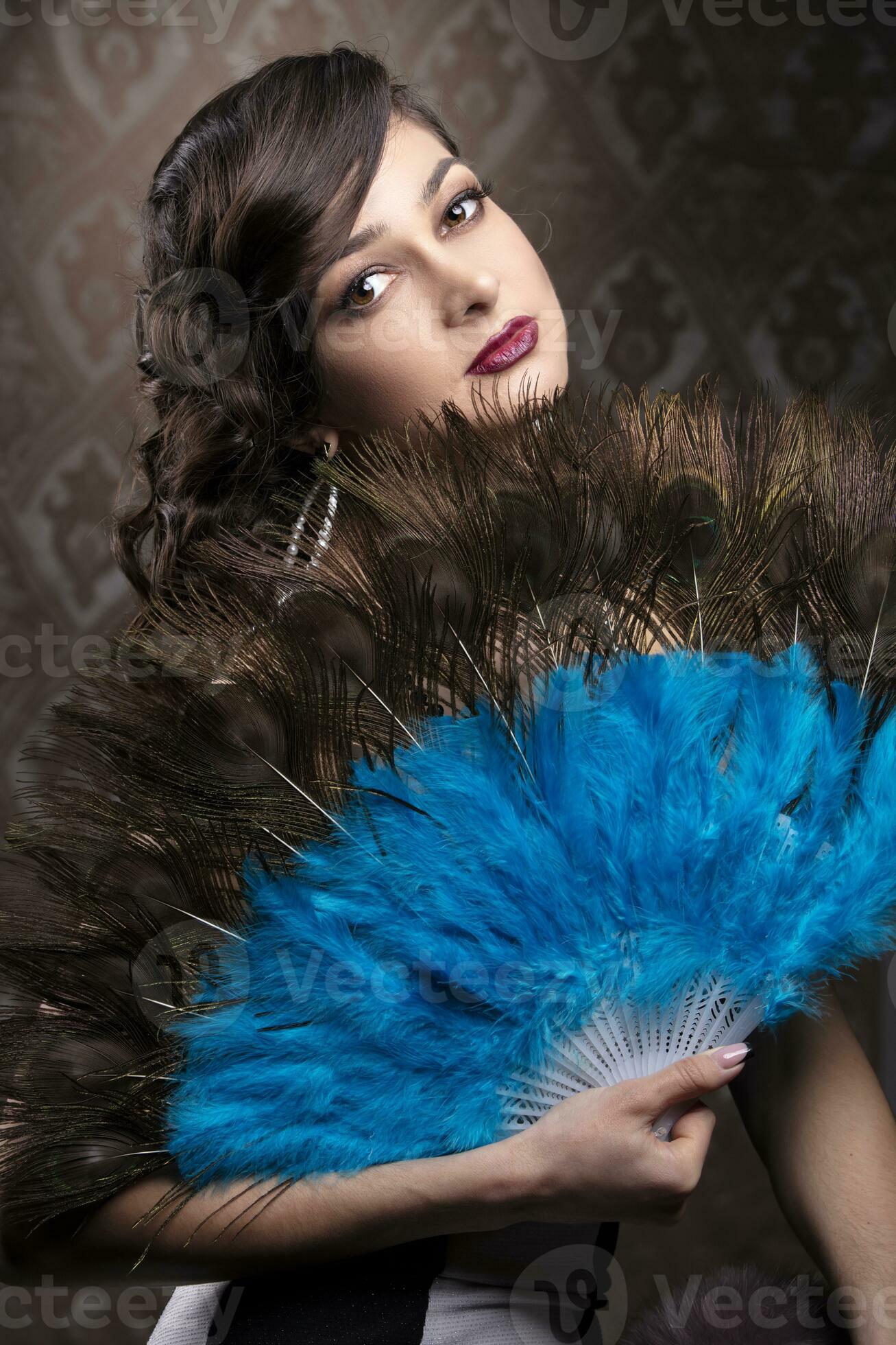 Retro woman portrait. Beautiful girl with a fan in the style of the 20s or  30s. Old fashionable Finger Wave makeup and hairstyle. 25012130 Stock Photo  at Vecteezy