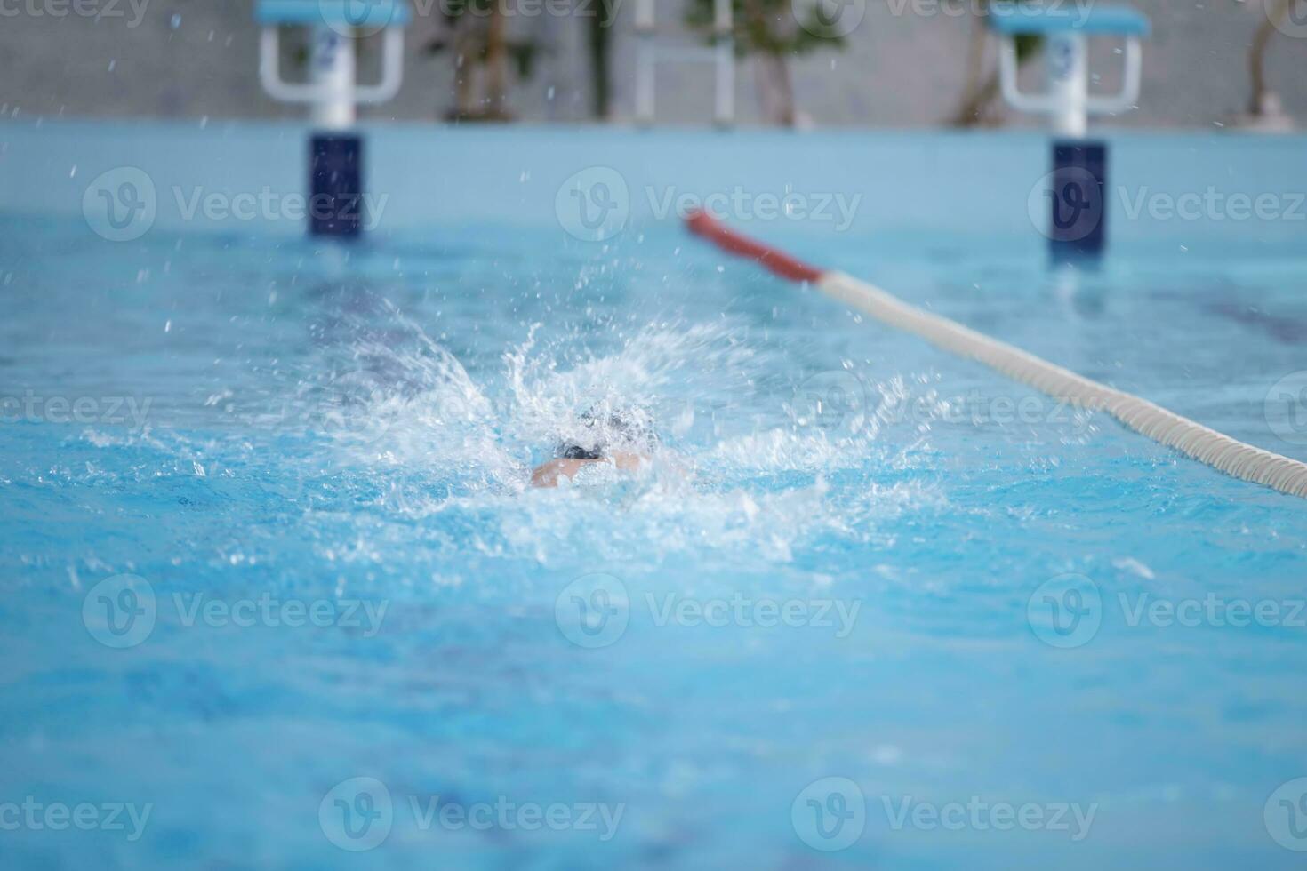 An athlete is swimming in the sports pool. photo