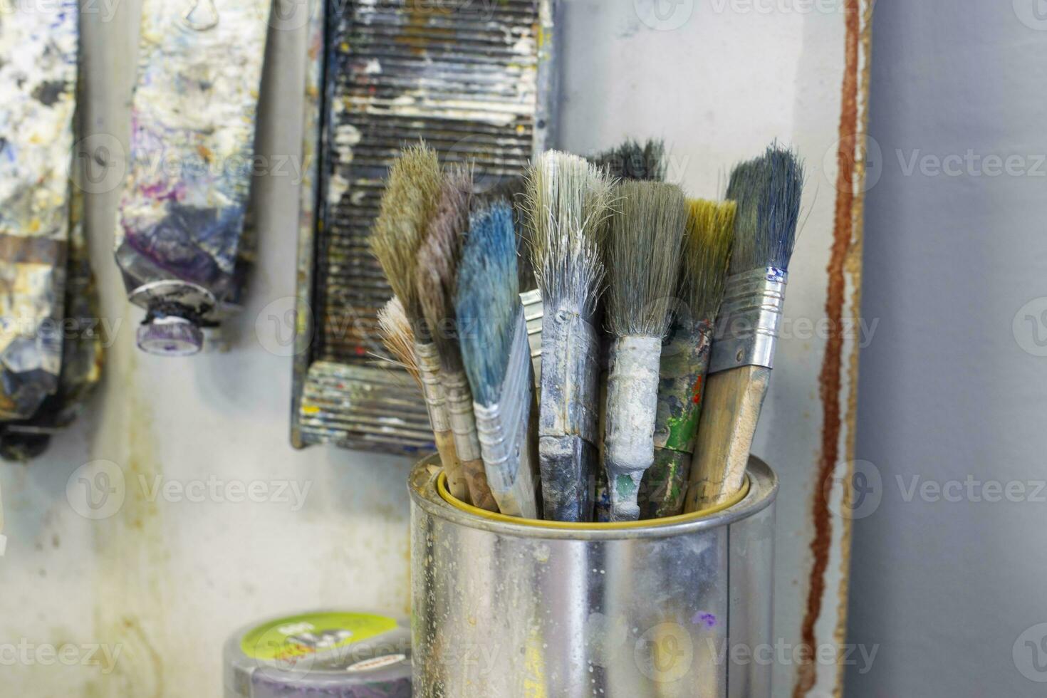 A tool for the artist. There are many paint brushes in the box. photo