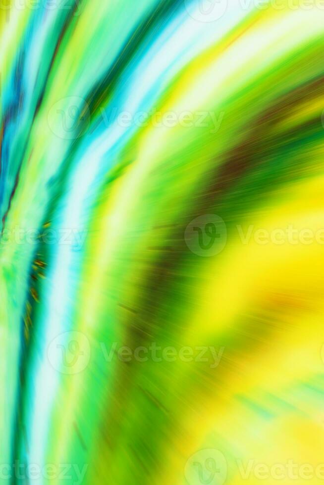 Blurred multicolored colorful background with flying stripes. Bright abstraction. photo