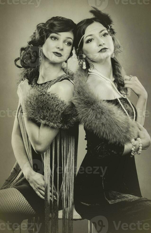 Black and white photograph of beautiful women in the style of 20s or 30s. photo