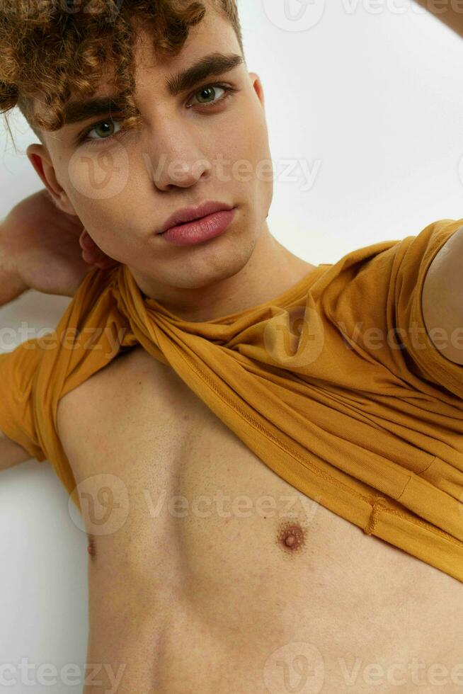 handsome guy in yellow t-shirts gesture hands emotions Lifestyle unaltered photo