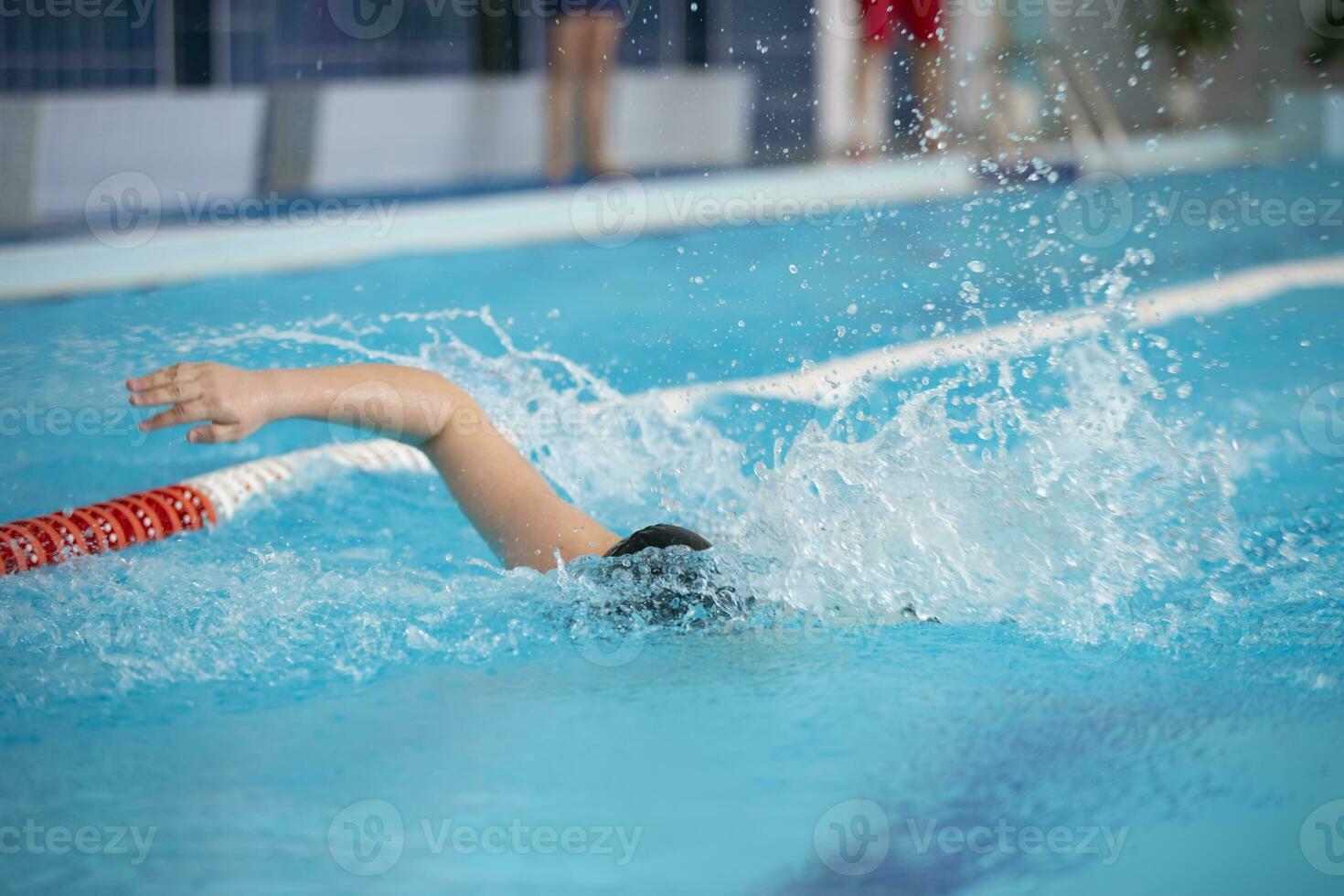 An athlete is swimming in the sports pool. photo