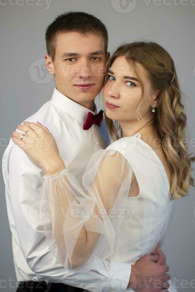 Vertical classic portrait of beautiful bride and groom. photo