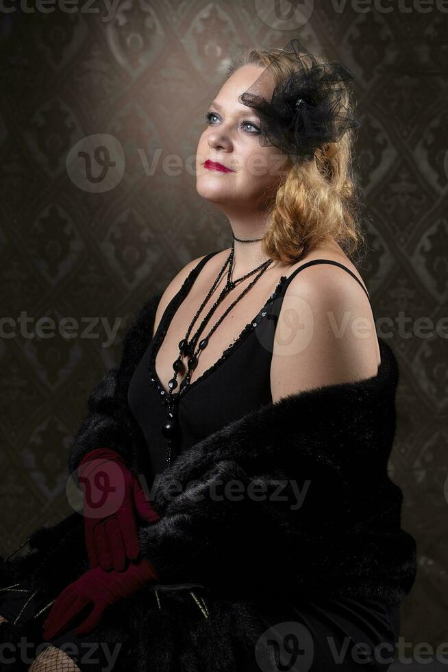 Retro portrait of an elderly woman in the style of 20s or 30s. photo