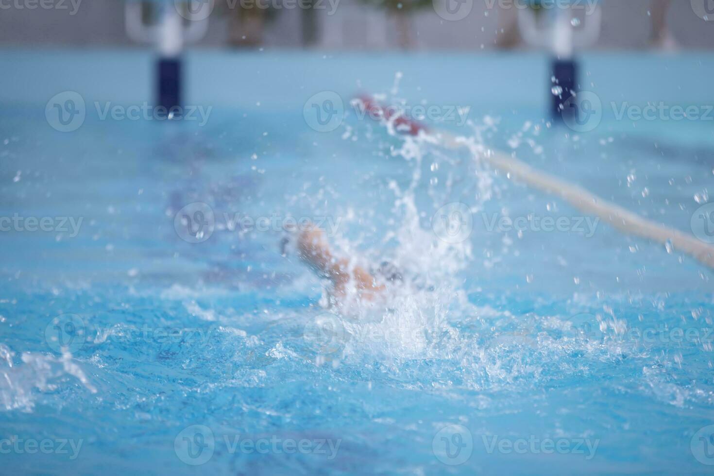 An athlete is swimming in the sports pool. photo