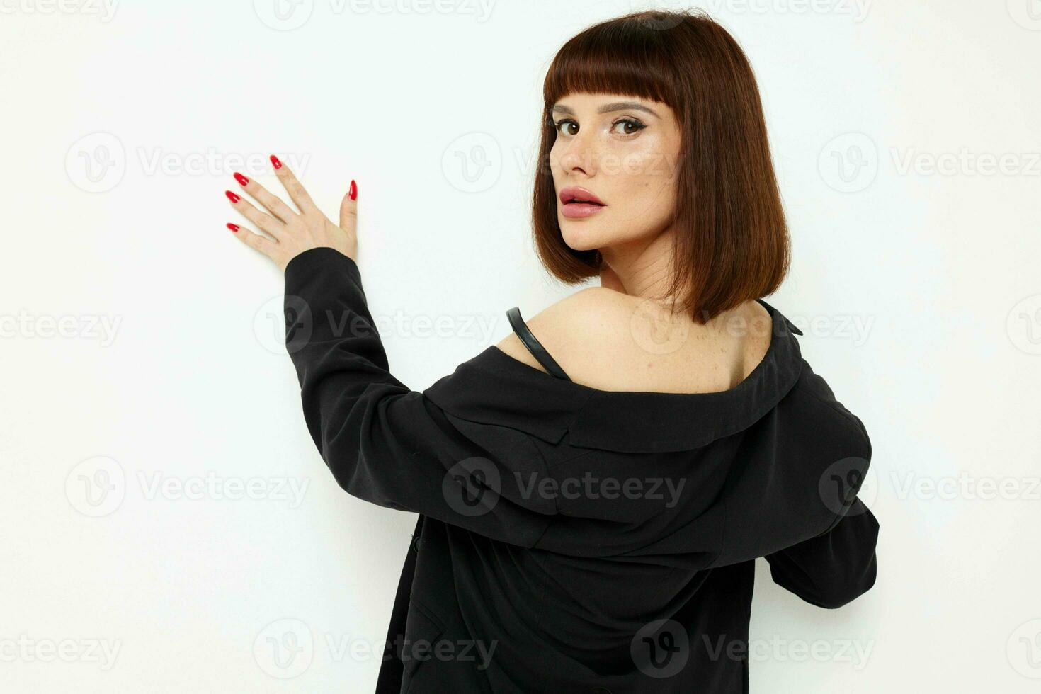 portrait of a woman in leather skirts posing glamor sexy light background photo