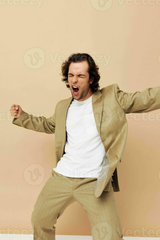 handsome man in beige suit elegant style Lifestyle unaltered photo