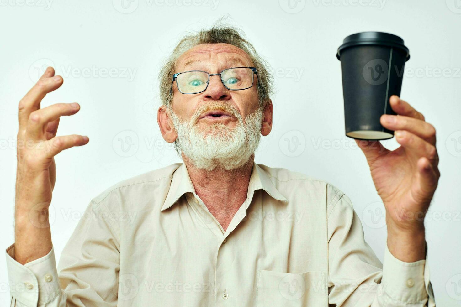 Senior grey-haired man with a gray beard in a shirt and glasses cropped view photo