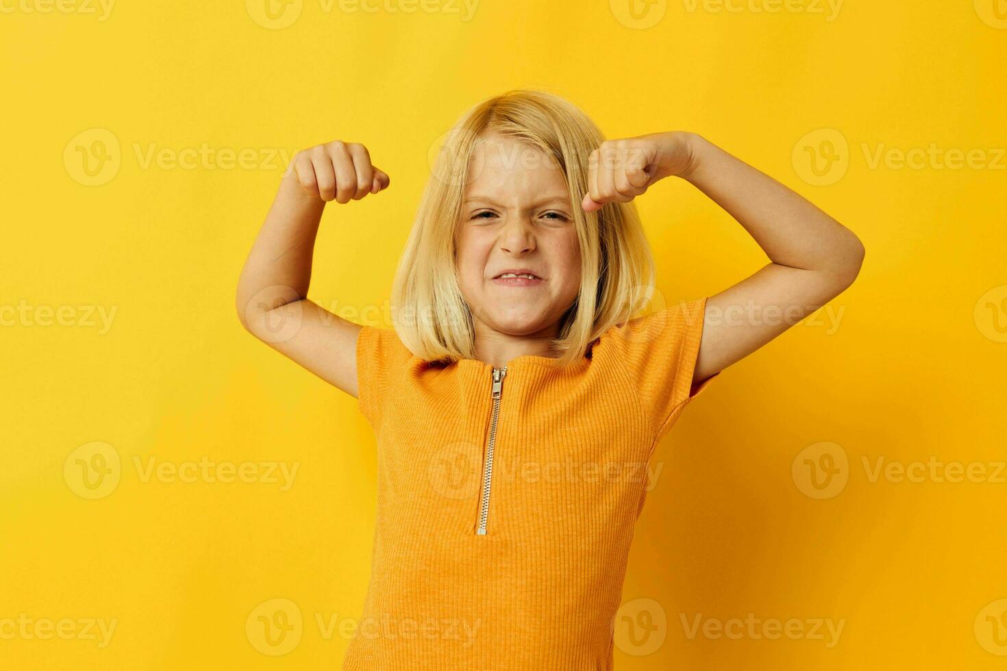 kid girl blonde straight hair posing smile fun color background unaltered photo