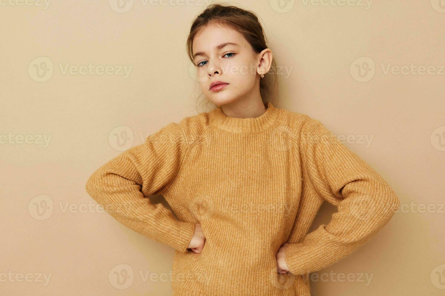 little girl in sweater posing hand gestures Lifestyle unaltered photo