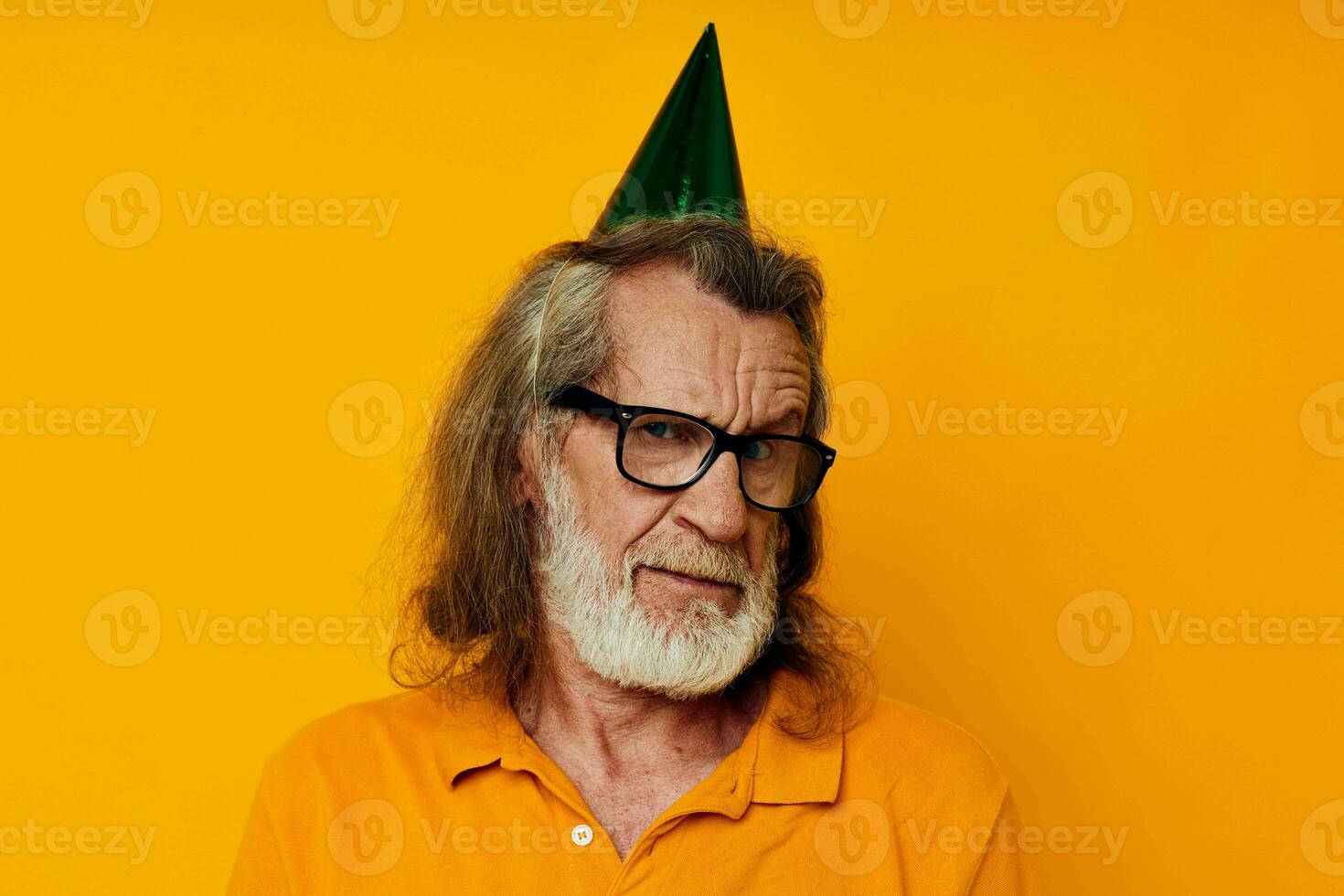 elderly man in a yellow t-shirt with a cap on his head fun monochrome shot photo